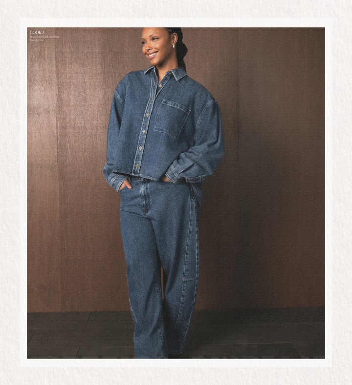 Person wearing a blue denim outfit against a brown background