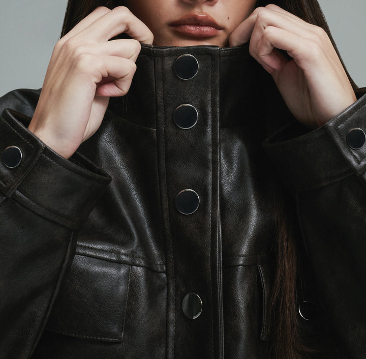 Model wearing WeWoreWhat Vegan Leather 90's jacket
